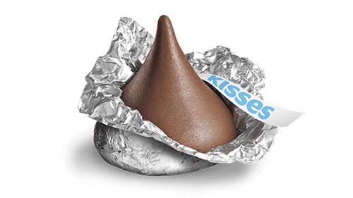 partially unwrapped hersheys kisses milk chocolate candy