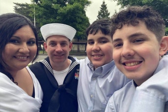 service member smiling with family