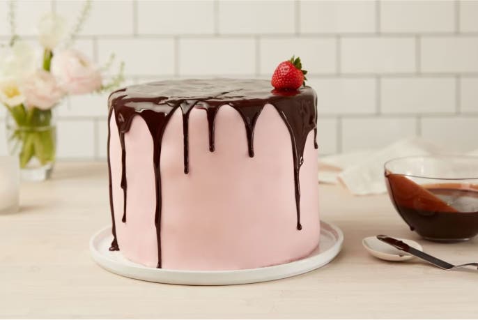 pink cake topped with chocolate drip