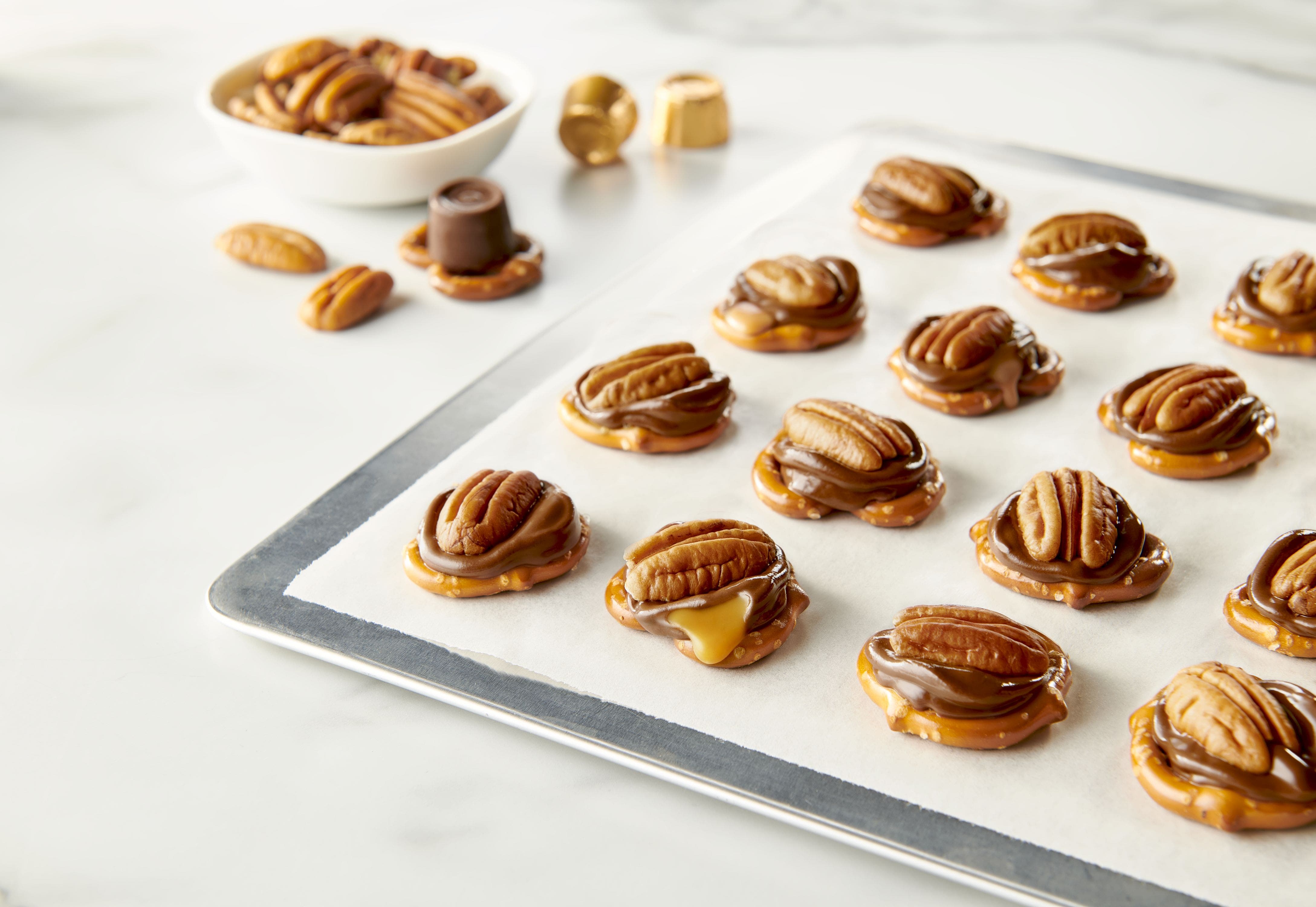 topping the melted rolo creamy caramels with fresh pecans