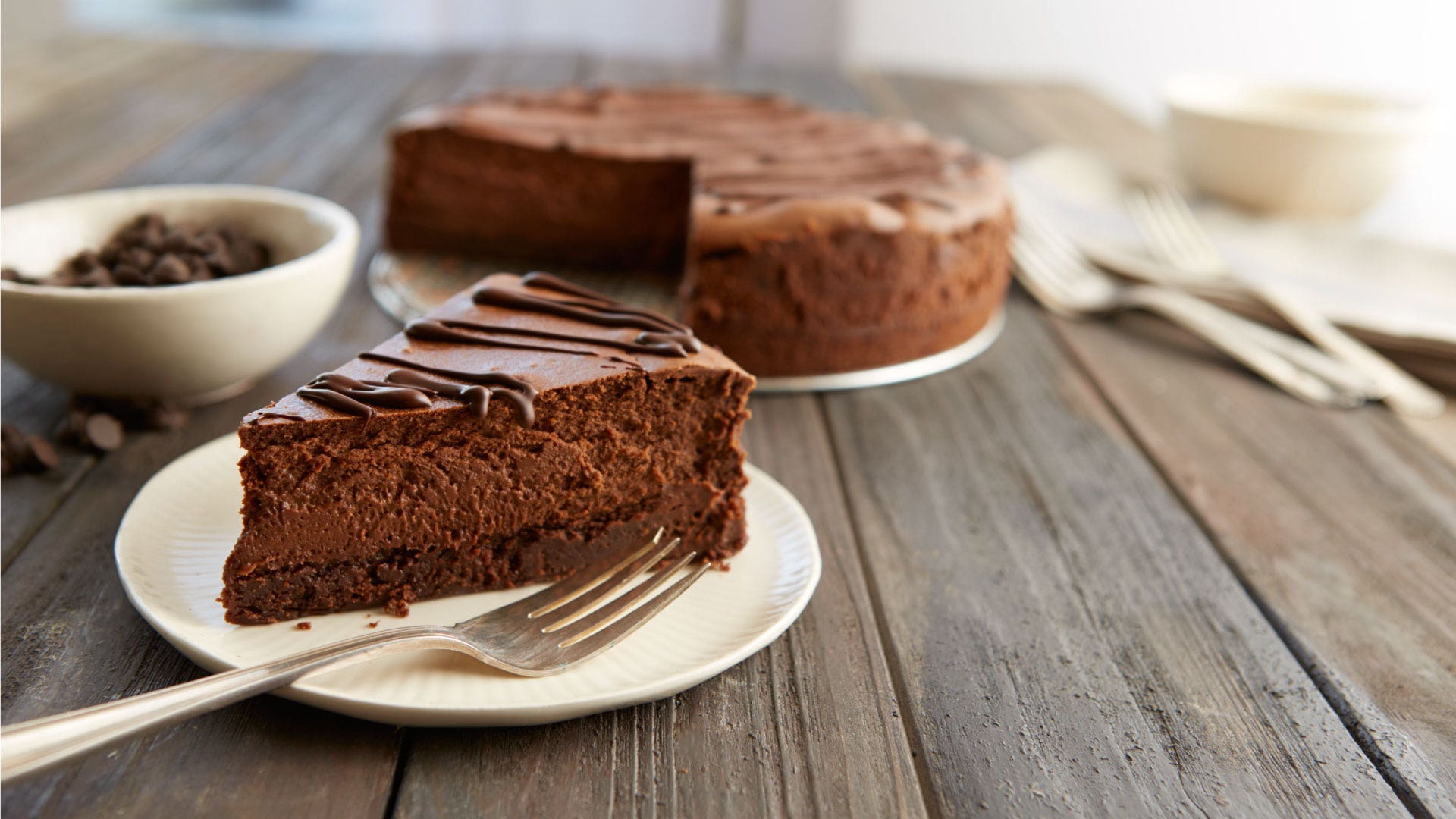 Image of HERSHEY'S Special Dark Truffle Brownie Cheesecake