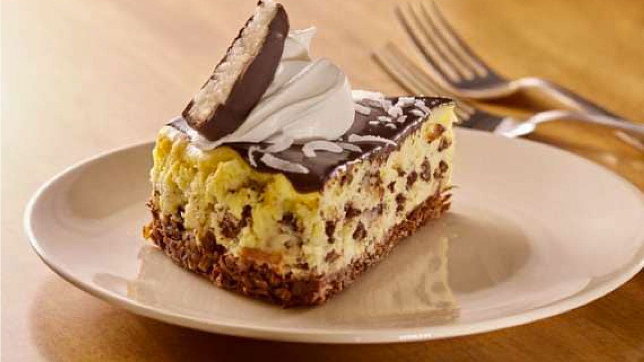 Image of MOUNDS Candy Coconut Cheesecake With Chocolate Glaze