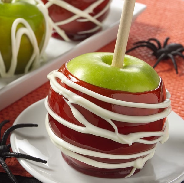 candy apples with white creme spider webbing design