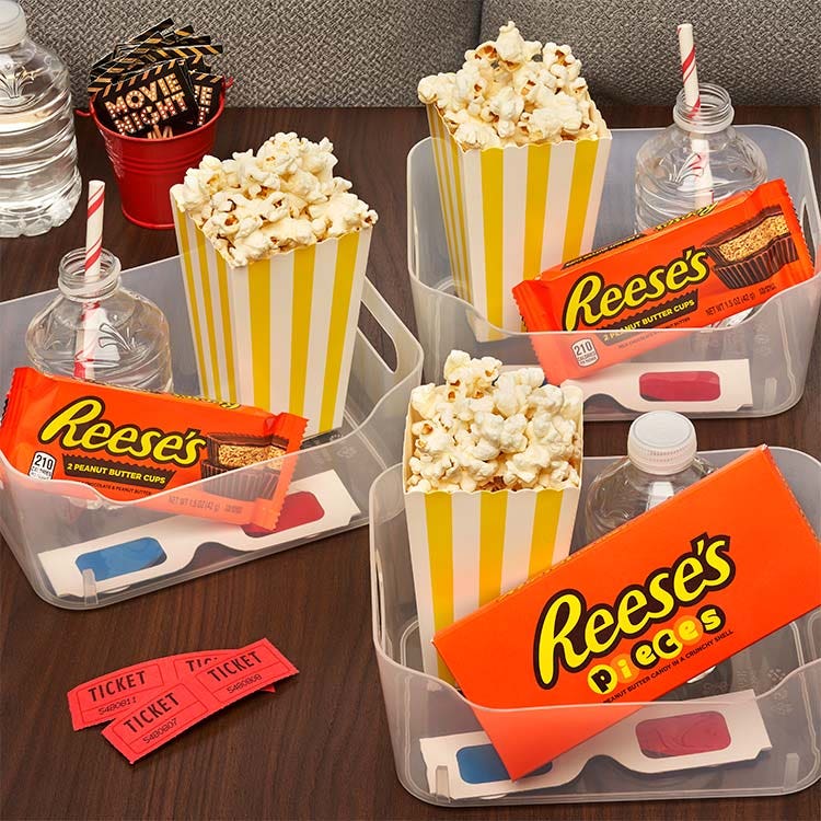 clear bins filled with sweet and salty movie night snacks