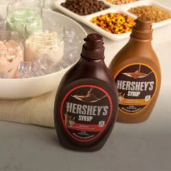 ice cream sundae bar with toppings and hershey syrup