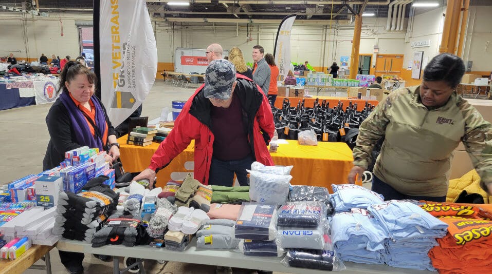 veterans looking through clothing items for their sizes