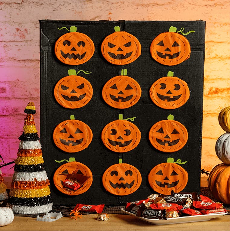 poke a pumpkin game with plate of candy