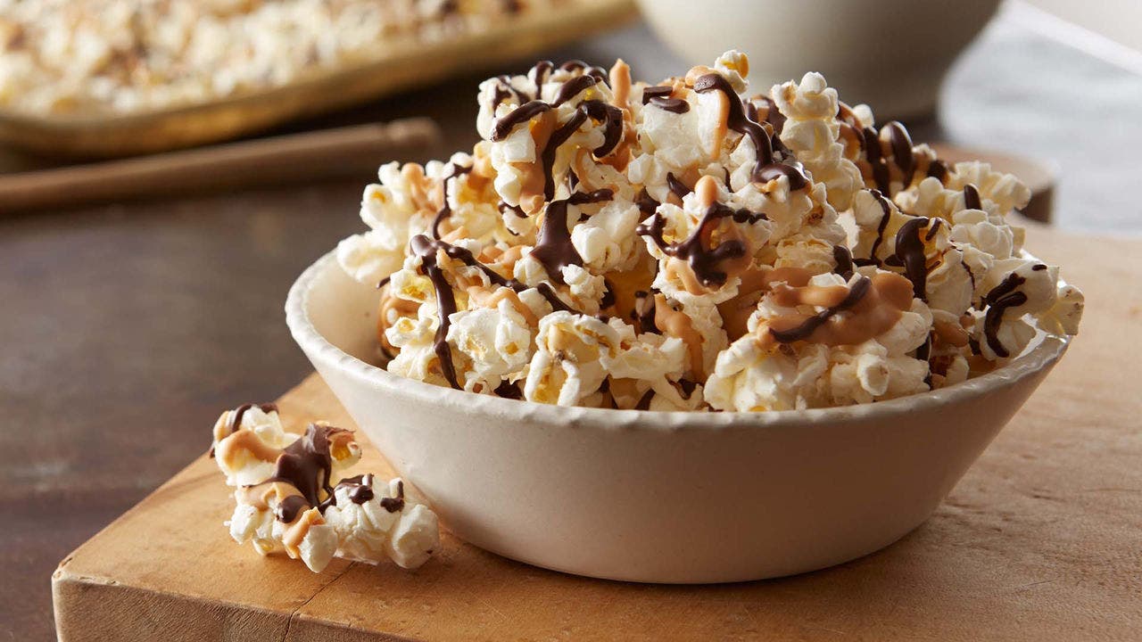 bowl of popcorn with chocolate drizzle